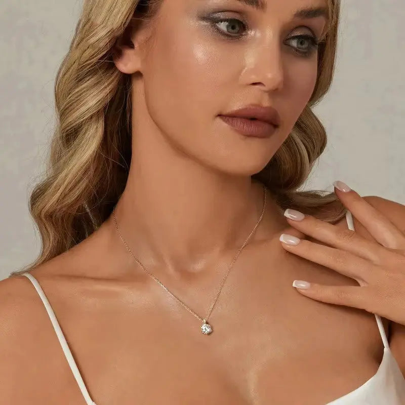 Blonde model wearing a 925 sterling silver moissanite pendant necklace – OmniVivo