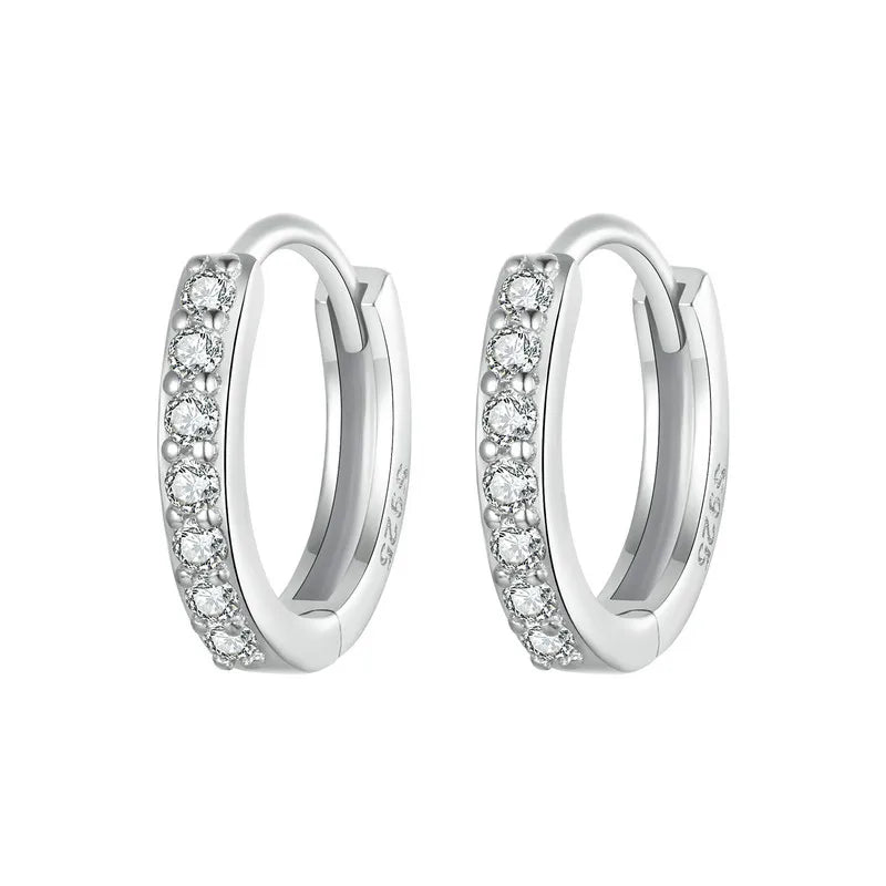 925 sterling silver huggie hoop earrings with pavé cubic zirconia on a white background — OmniVivo.