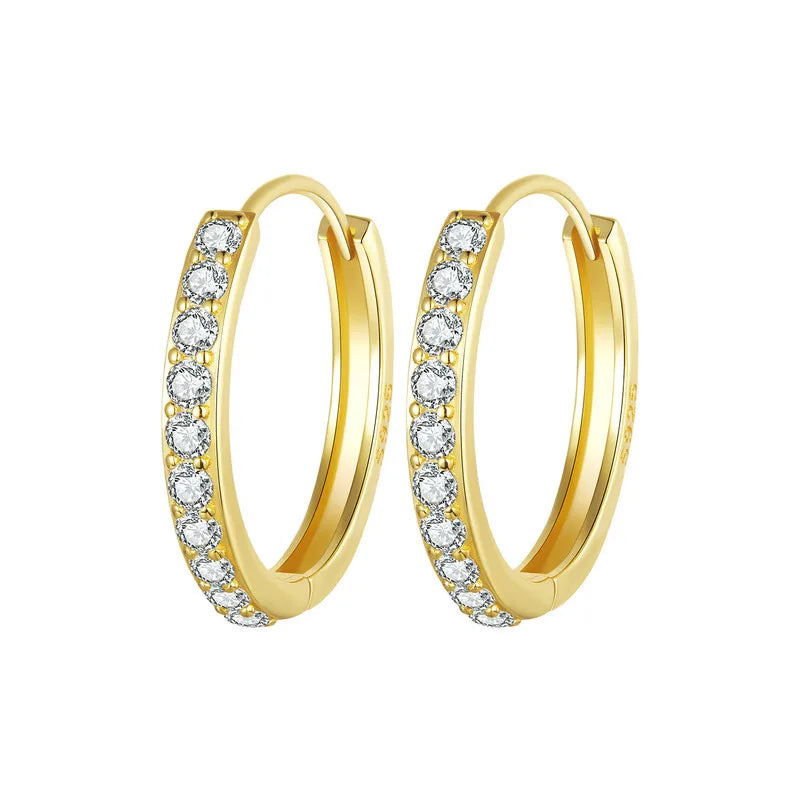 Gold-plated 925 sterling silver huggie hoop earrings with pavé cubic zirconia on a white background — OmniVivo