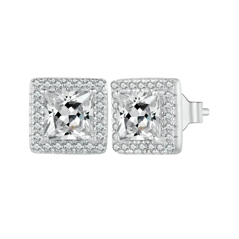 A sparkling pair of Serena Halo CZ Stud Earrings in 925 sterling silver, featuring a brilliant square-shaped central cubic zirconia stone encircled by a micro-pavé halo, showcasing their modern and elegant design.