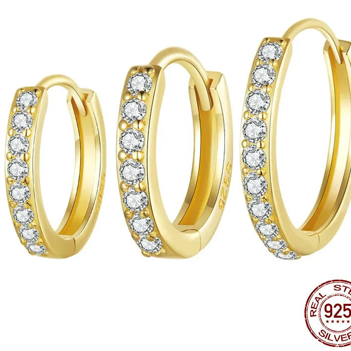 OmniVivo 925 sterling silver gold-plated CZ huggie hoop earrings for women (BSE1060), close-up pair with pavé cubic zirconia and secure clasp.