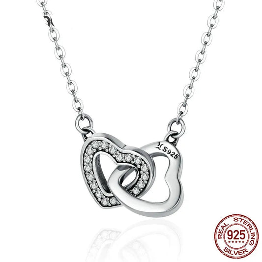 925 sterling silver connected heart pendant necklace with zircon stones, polished link chain, minimalist romantic style on white background — OmniVivo