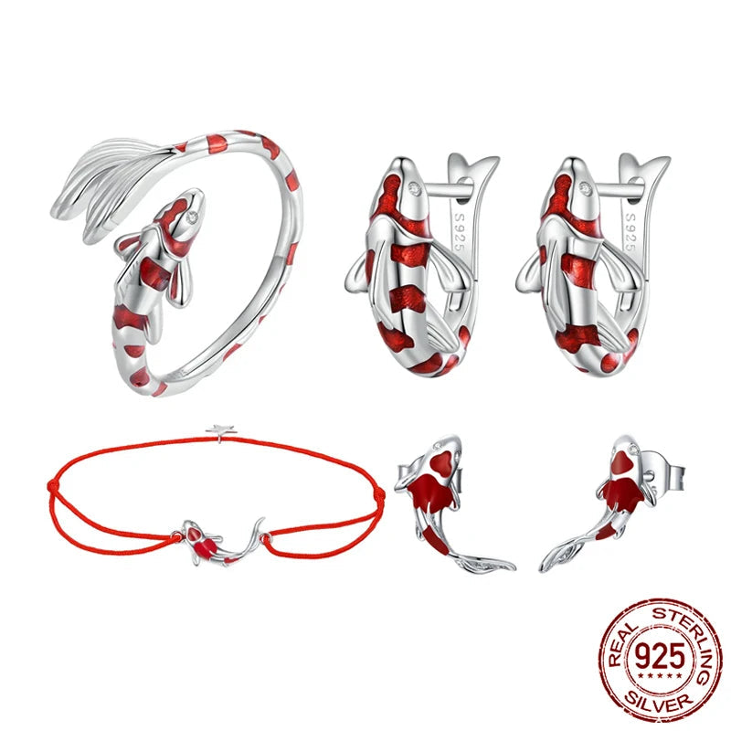 Guardian lucky fish jewelry set in 925 sterling silver with red enamel — adjustable red rope bracelet, matching ring, and stud earrings on a white background — OmniVivo