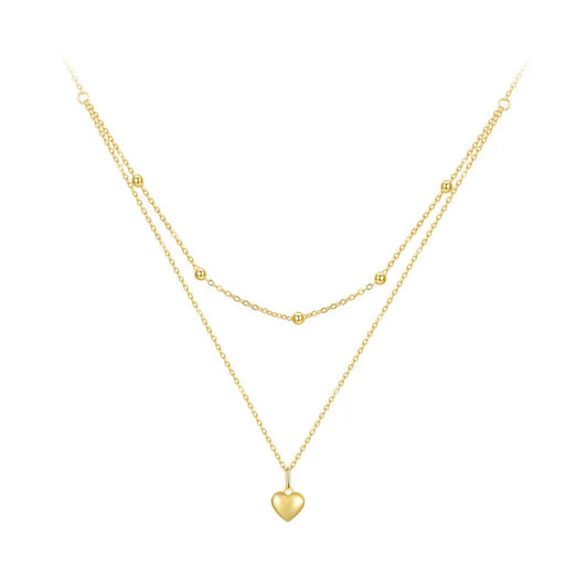 Gold-tone double-layer 925 sterling silver heart pendant necklace with beaded station and link chains on a white background — OmniVivo