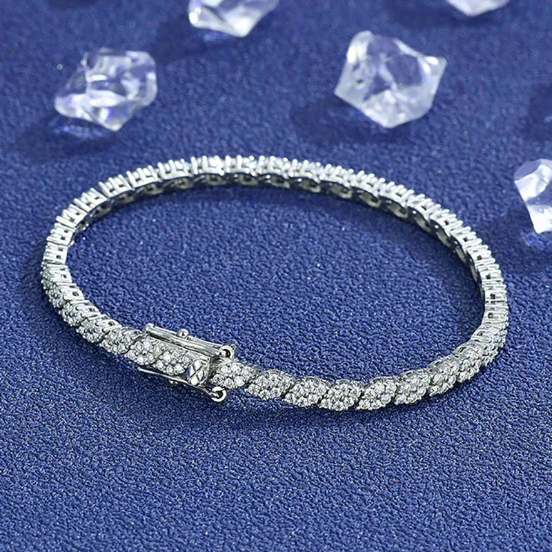 Moissanite tennis bracelet in 925 sterling silver with D color VVS1 stones, classic single-row design on blue textured background — OmniVivo
