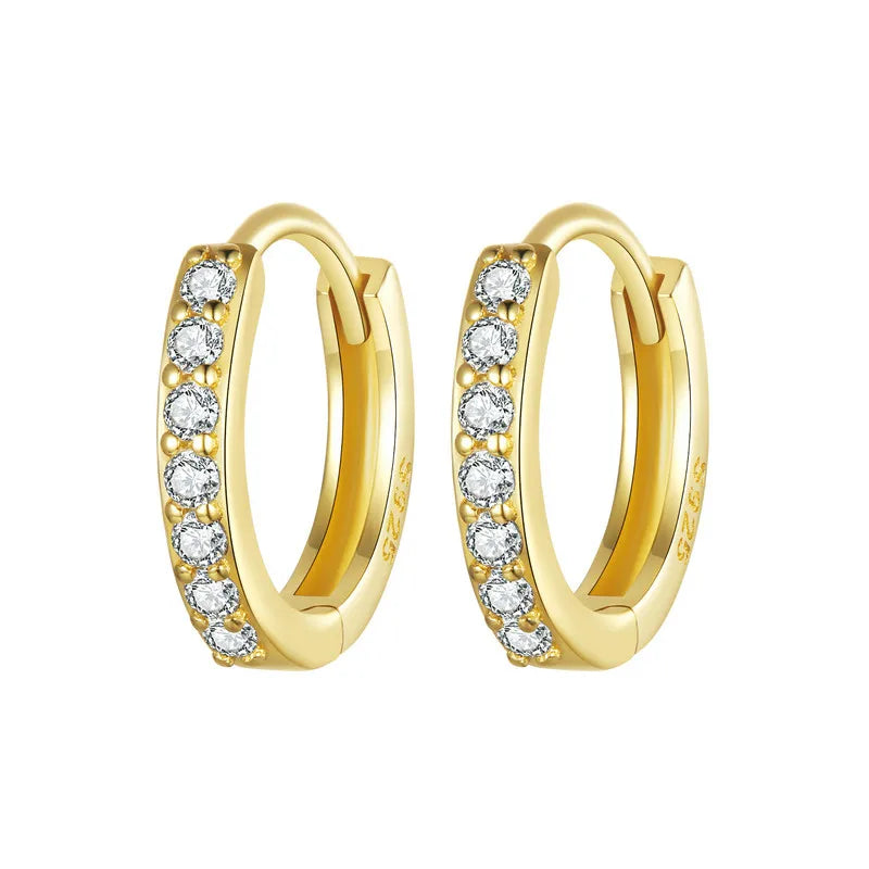 Gold-plated 925 sterling silver huggie hoop earrings with pavé cubic zirconia on a white background — OmniVivo.