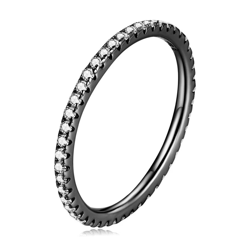 Slim 925 sterling silver eternity ring with black plating and clear CZ stones in a pavé setting, polished finish, displayed on a white background — OmniVivo