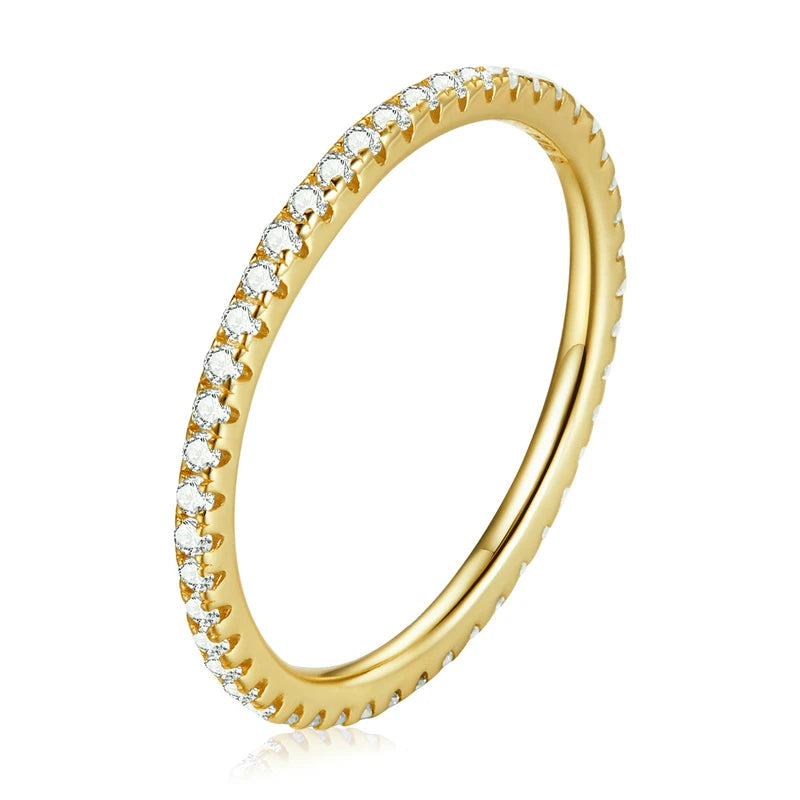 Slim 925 sterling silver eternity ring with gold plating and clear CZ stones in a pavé setting, polished finish, displayed on a white background — OmniVivo