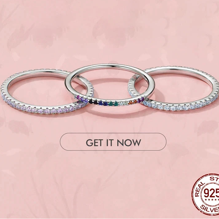 Three 925 sterling silver micro pavé eternity rings with 1.5mm CZ stones, slim stackable bands displayed on a pink background with polished finish — OmniVivo