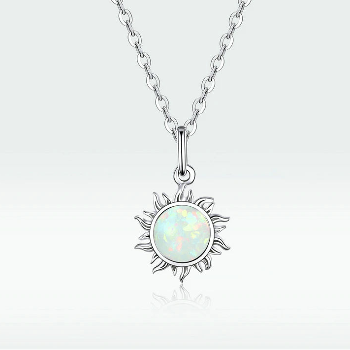 Sun-shaped opal pendant necklace crafted in 925 sterling silver, luminous opal center with symbolic celestial design, shown on a clean white background — OmniVivo
