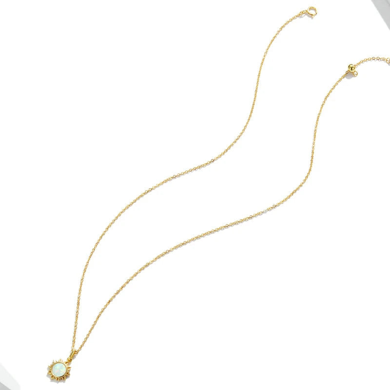 Gold plated opal sun pendant necklace crafted in 925 sterling silver, delicate chain with luminous opal center, shown in a full-length view on a clean white background — OmniVivo
