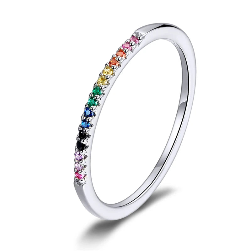 Slim 925 sterling silver eternity ring with rainbow CZ gemstones in a micro pavé setting, polished finish, displayed on a white background — OmniVivo