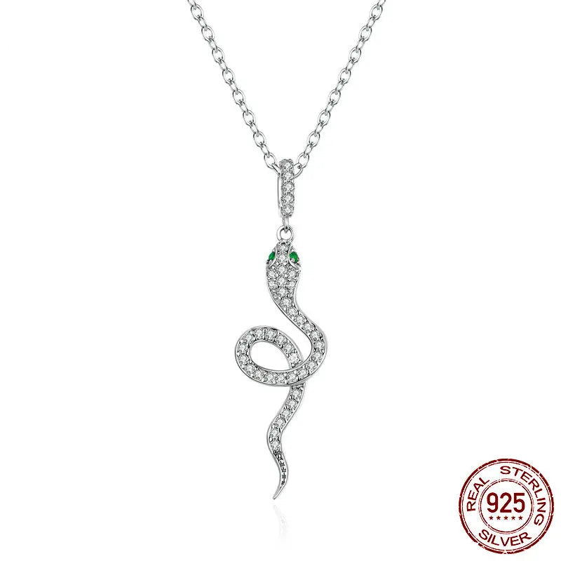 925 sterling silver snake pendant necklace with pavé CZ and green eye accents, adjustable 45 cm link chain, high-polish finish on white background — OmniVivo