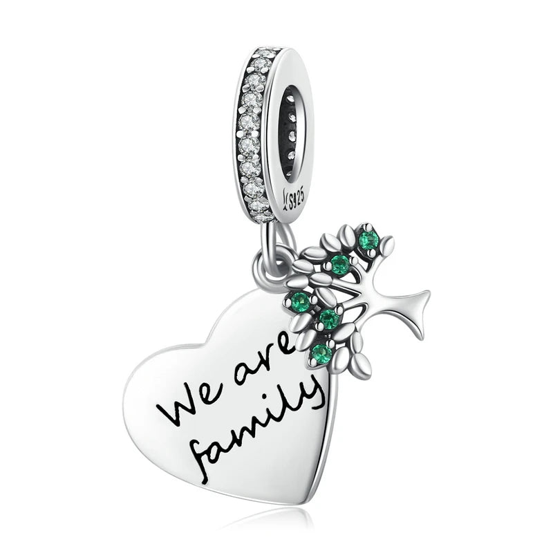 Alternate view of 925 sterling silver heart tag charm engraved with “We are family”, featuring green leaf accents and pavé bail, on white background — OmniVivo
