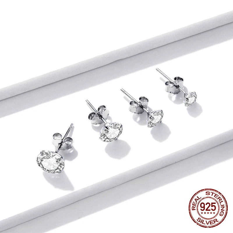 Set of 925 sterling silver CZ stud earrings in multiple sizes on a white background, hypoallergenic polished finish, classic round studs — OmniVivo
