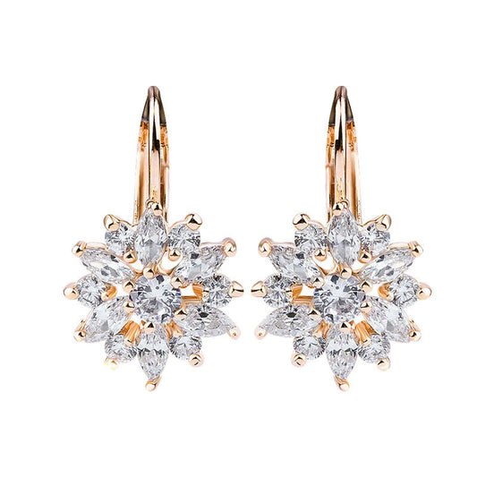 Floral crystal clip-on earrings in rose gold tone with pear-cut and round stones - elegant statement jewelry