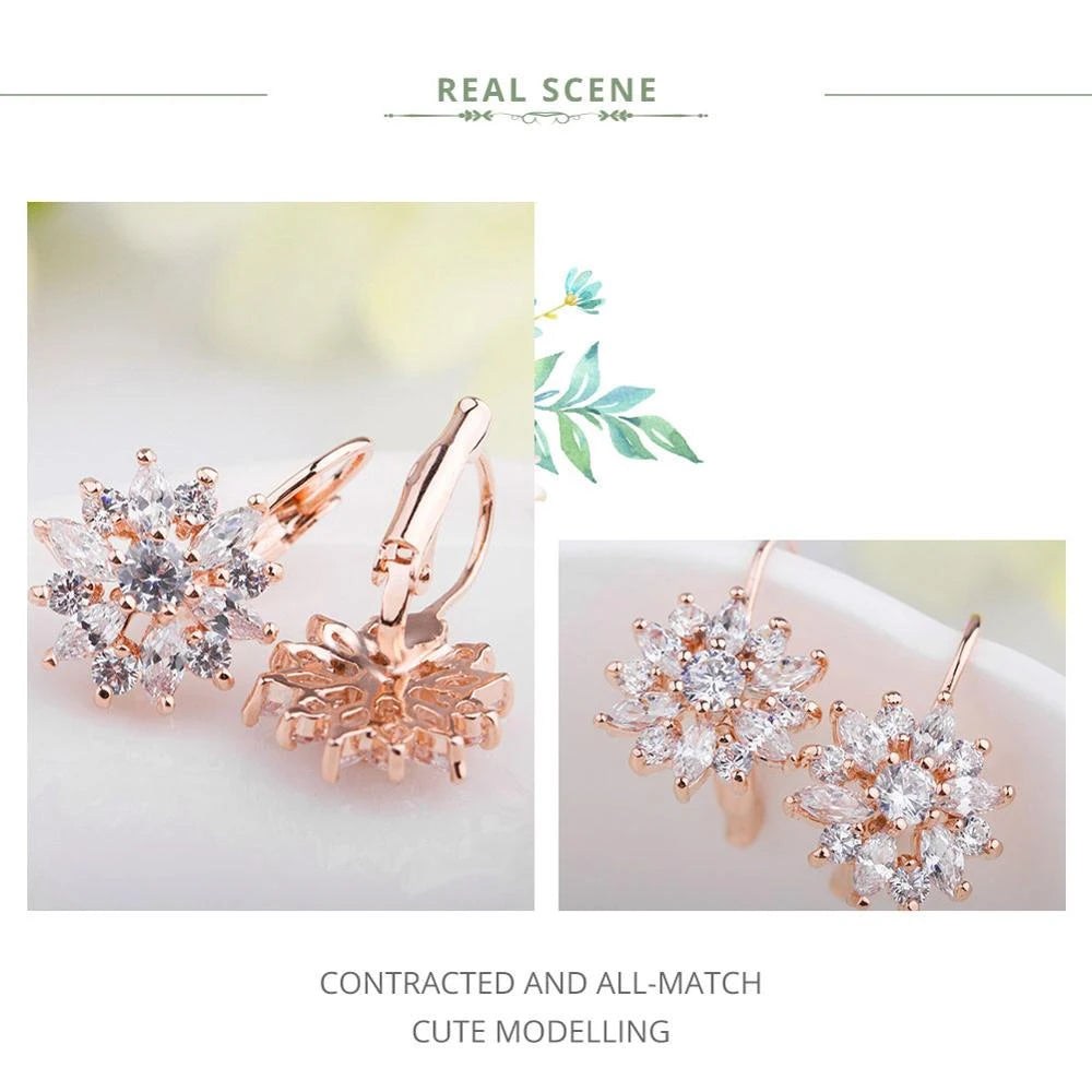 18K rose gold–plated flower cluster leverback earrings set with AAA zircon crystals; soft lifestyle collage on light background with greenery accents — OmniVivo