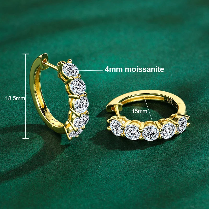 925 sterling silver hoop earrings plated in 14K yellow gold, set with 4 mm round-cut moissanite; technical diagram showing 18.5 mm height and 15 mm inner diameter on green background — OmniVivo