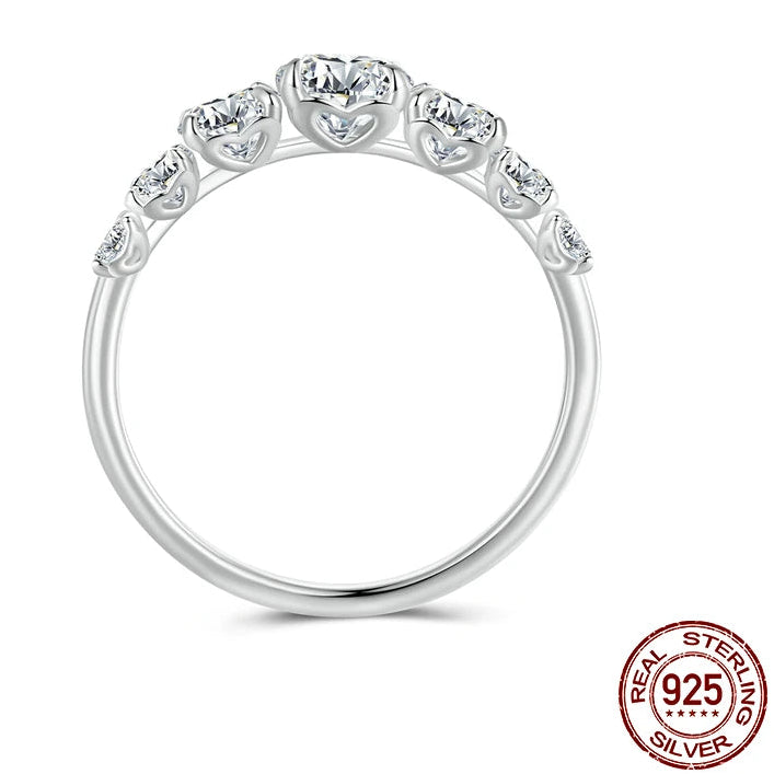 Back view of 925 sterling silver moissanite ring featuring multiple D color stones in prong setting on white background — OmniVivo

