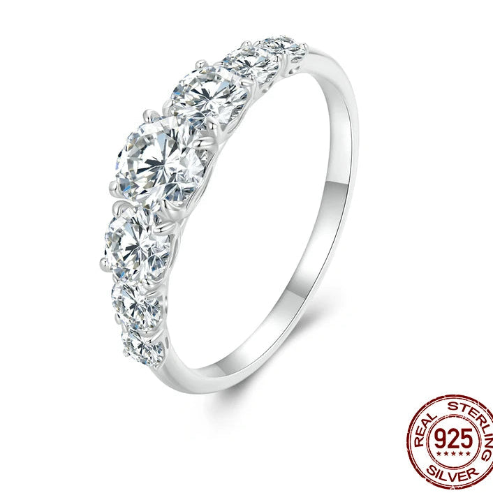 925 sterling silver moissanite ring with multiple D color stones in a prong setting on white background — OmniVivo
