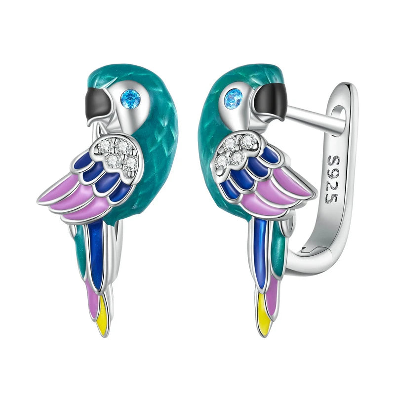 A vibrant pair of sterling silver parrot-shaped hoop earrings, meticulously detailed with teal, pink, and blue enamel, featuring sparkling cubic zirconia on the wings and blue crystal eyes, perfect for a cheerful and stylish look.
