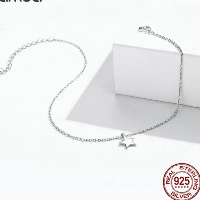 Minimalist star anklet in 925 sterling silver with lobster clasp adjustable chain, displayed on white background with “Real Sterling Silver 925” stamp — OmniVivo
