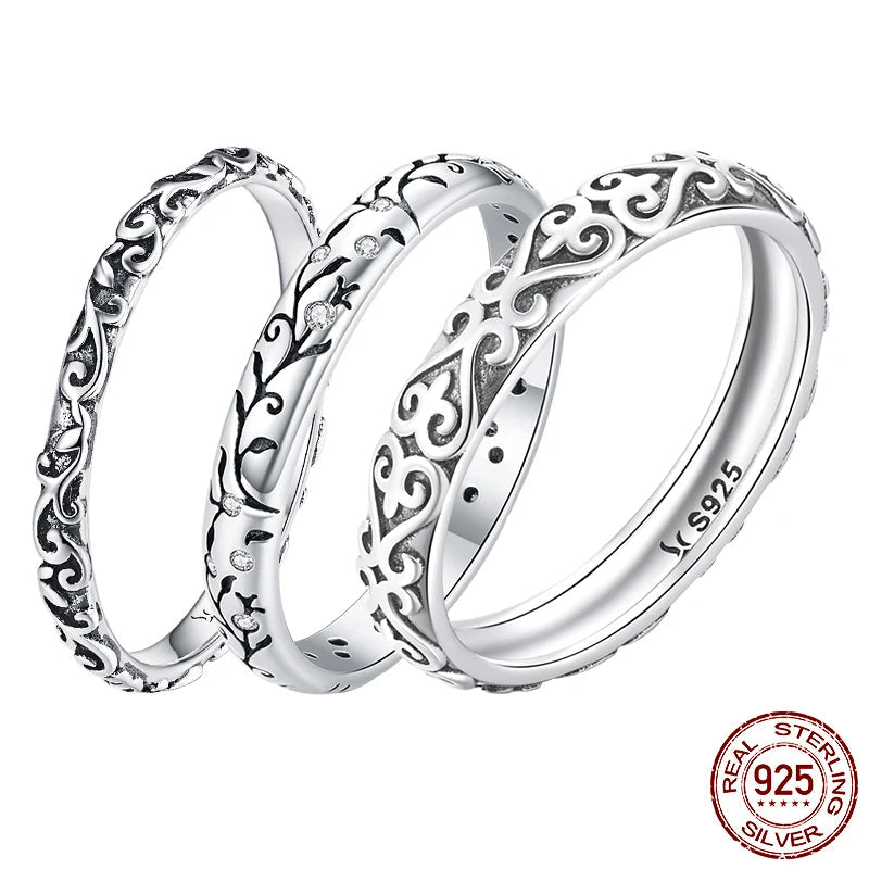 Set of three vintage embossed vine/filigree stackable band rings in authentic 925 sterling silver, S925 stamped, on a white background — OmniVivo
