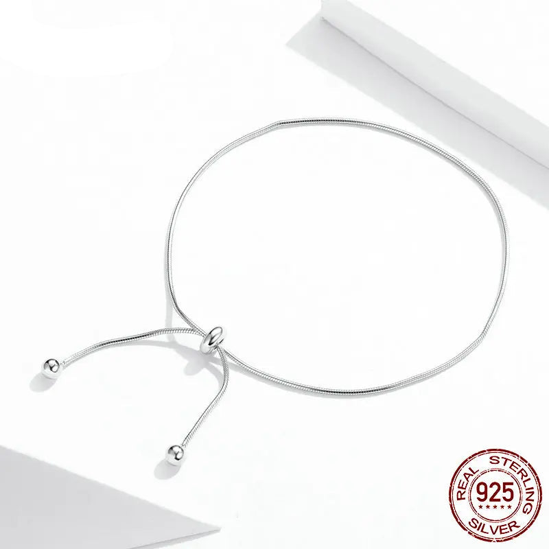 Adjustable 925 sterling silver snake chain anklet with sliding bead ends on a clean white background, featuring a 925 sterling stamp badge.