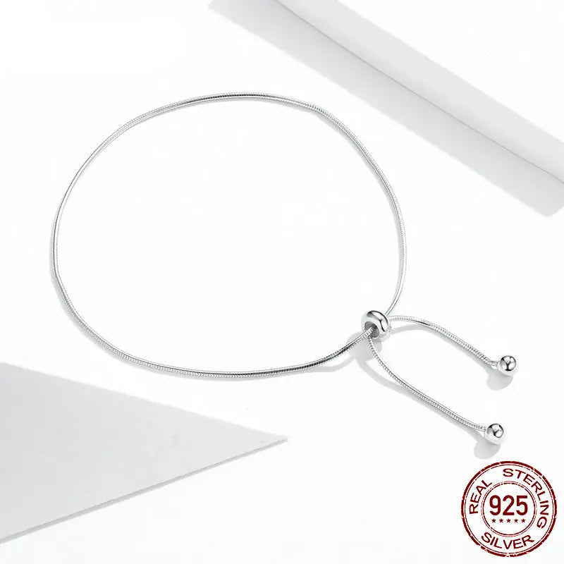 Adjustable 925 sterling silver snake chain anklet with sliding bead ends on a clean white background, showing a 925 sterling seal badge.