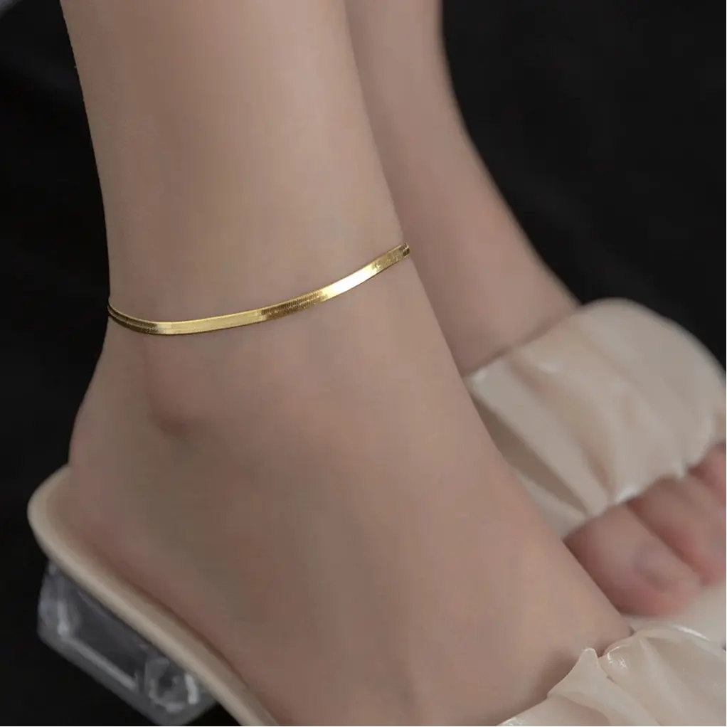 Minimalist flat gold anklet for women – worn on ankle – OmniVivo