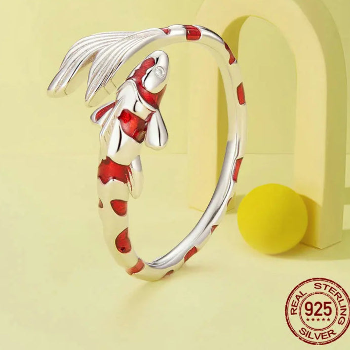 Guardian lucky fish ring in 925 sterling silver with red enamel—adjustable open band, symbolic animal design on a yellow background — OmniVivo