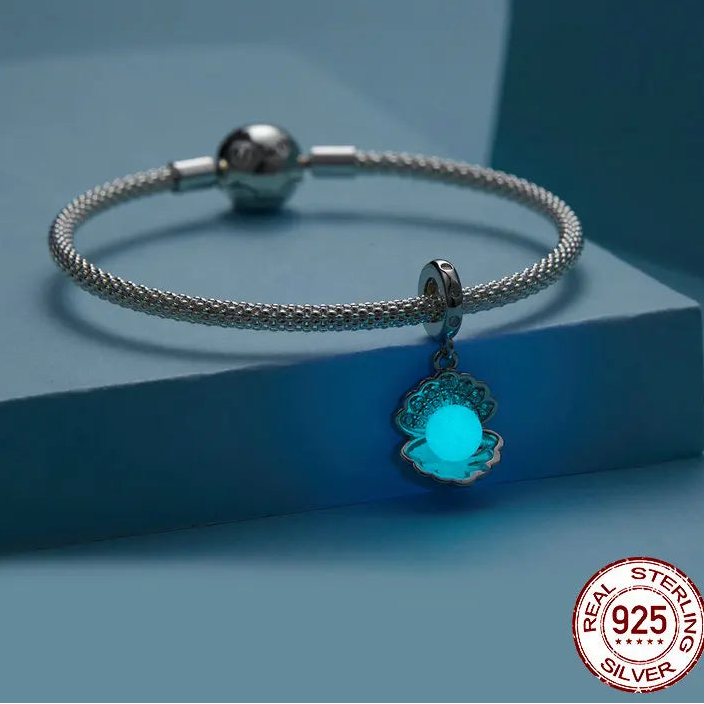 Glow-in-the-dark blue shell charm on 925 sterling silver bracelet, luminous enamel with zircon accents — OmniVivo
