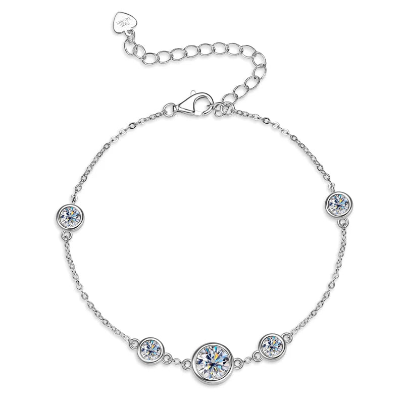 925 sterling silver moissanite station bracelet with 6.5 mm center and bezel-set accents, adjustable extender with heart tag — OmniVivo