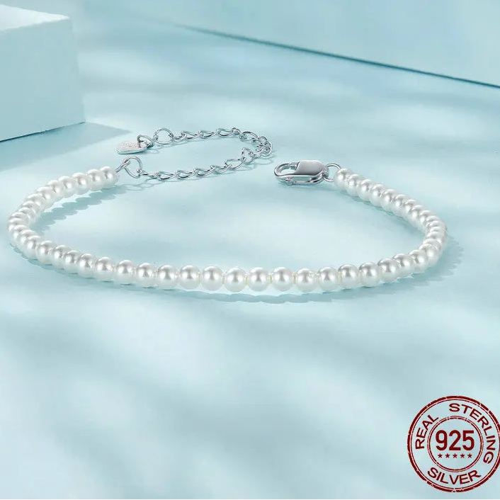 925 sterling silver pearl bracelet with shell pearls and adjustable chain on light blue background — OmniVivo
