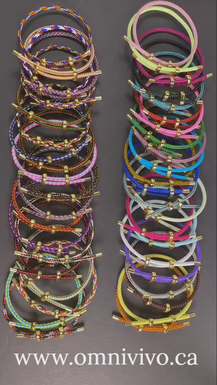 Product video—adjustable multicolor rope bracelets with stainless steel wire and gold-tone ends, stacked display on a neutral background — OmniVivo