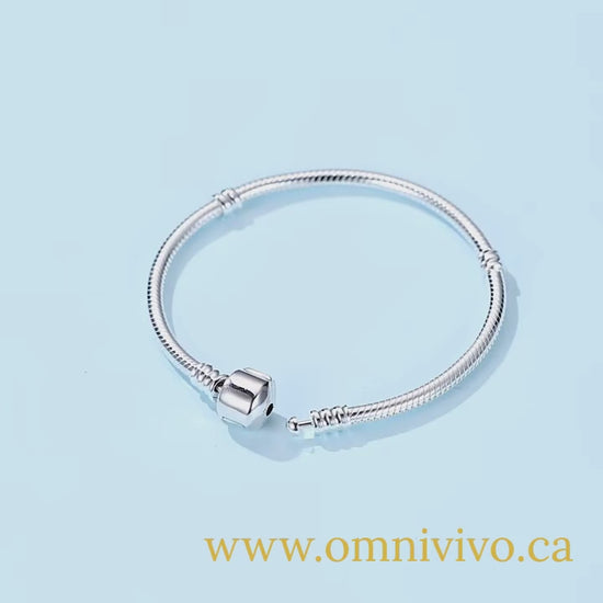 925 sterling silver snake chain bangle, 3 mm, barrel clasp on a light blue background (adjustable 17–22 cm)