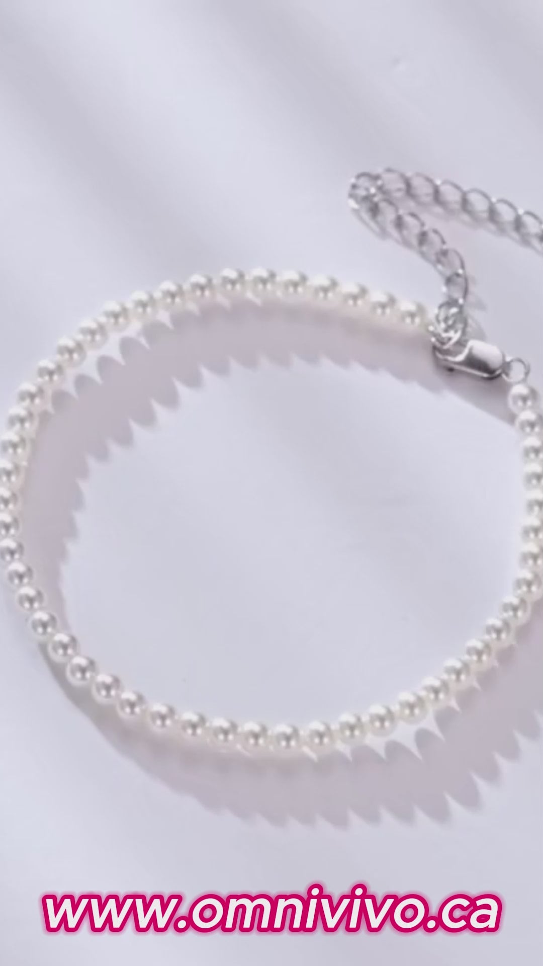Vertical video of a shell pearl beaded bracelet in 925 sterling silver with adjustable extender, soft light close-ups — OmniVivo.