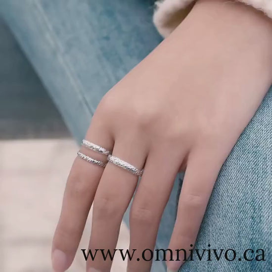 Stackable vintage embossed vine and iris band rings in authentic 925 sterling silver, slim minimalist design shown on hand — OmniVivo