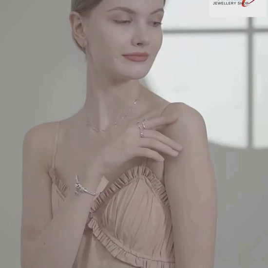 Try-on video of a double-layer 925 sterling silver heart pendant necklace with beaded station and link chains, worn on model — OmniVivo