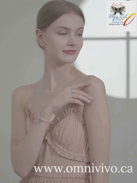 Try-on video of a double-layer 925 sterling silver heart pendant necklace with beaded station and link chains, worn on model — OmniVivo