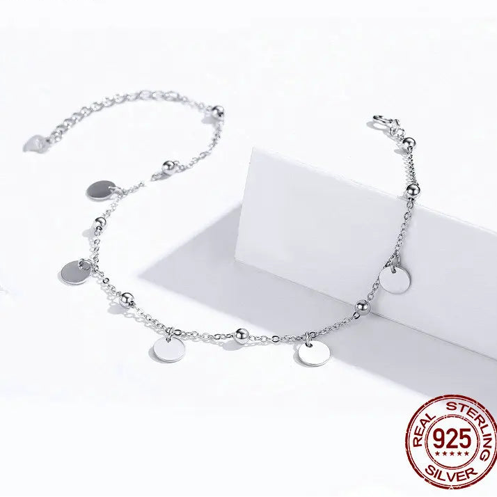 925 sterling silver minimalist bead anklet with geometric charms on a white background — OmniVivo