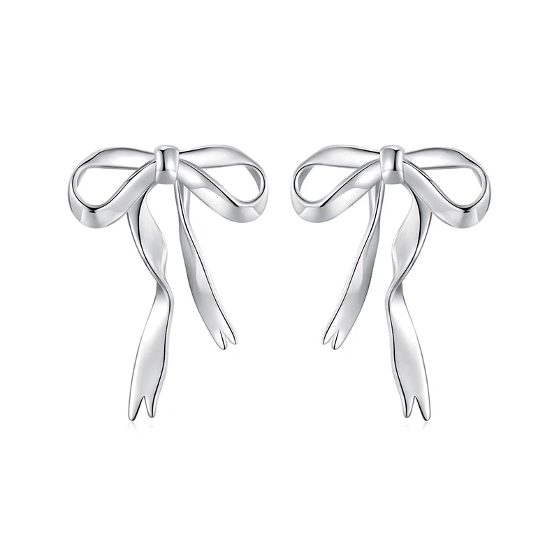 925 sterling silver bow ribbon stud earrings with long tails on a white background.