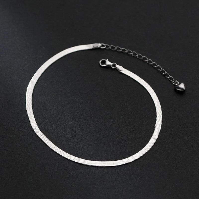 925 sterling silver snake chain anklet with adjustable extender, displayed on a black background — OmniVivo